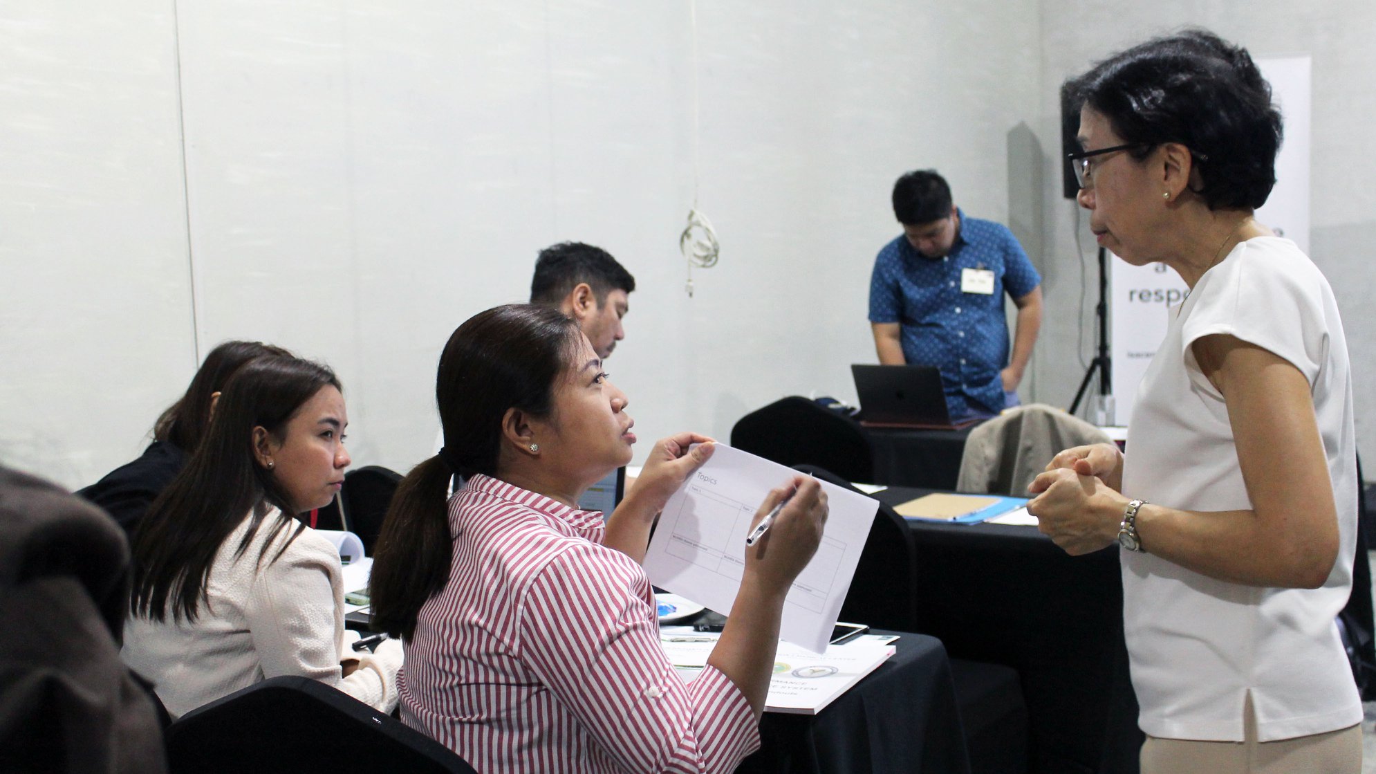 Dr. Effie Espino facilitating a workshop on outlining a research agenda for each hospital.
